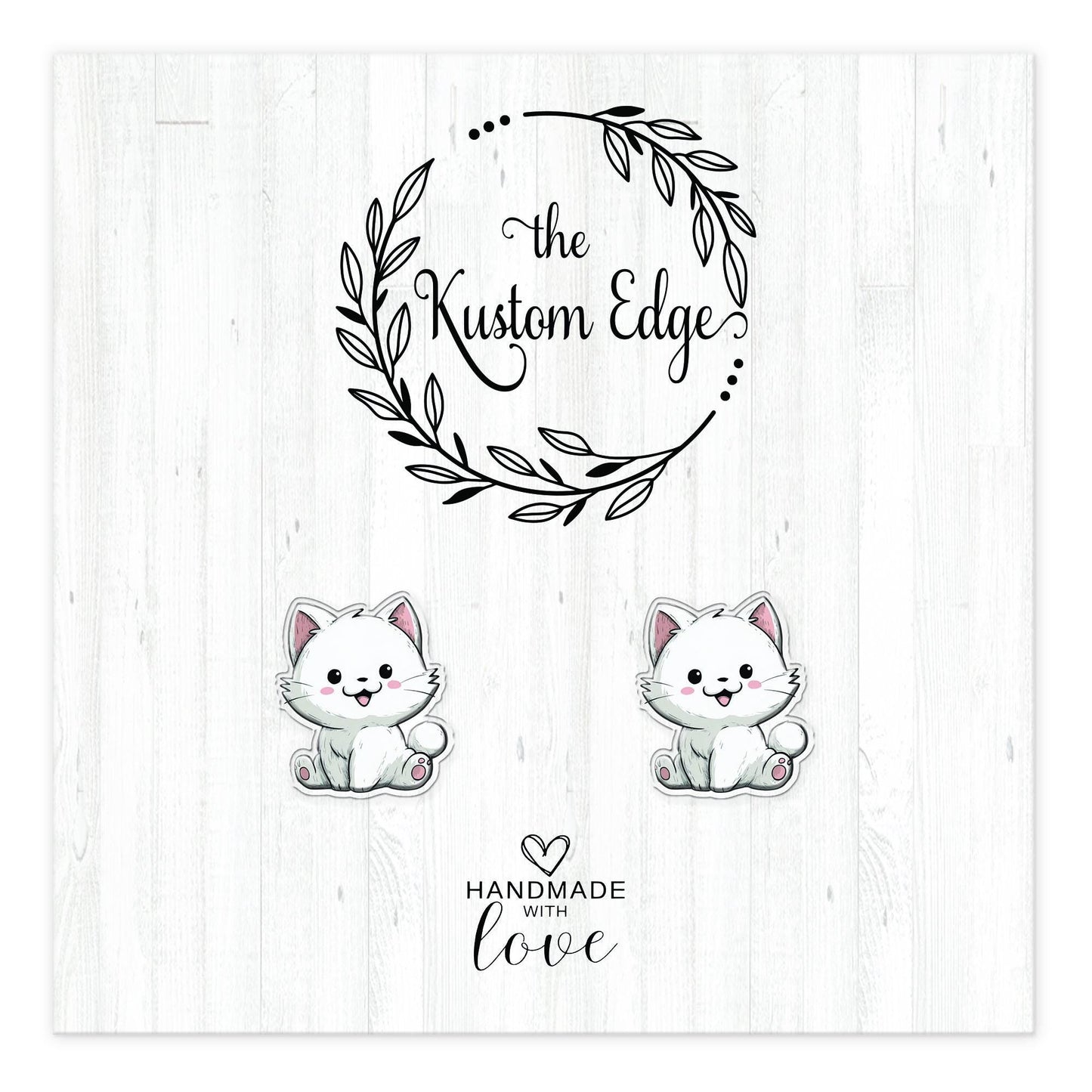 White kitten stud earrings on The Kustom Edge branded earring card