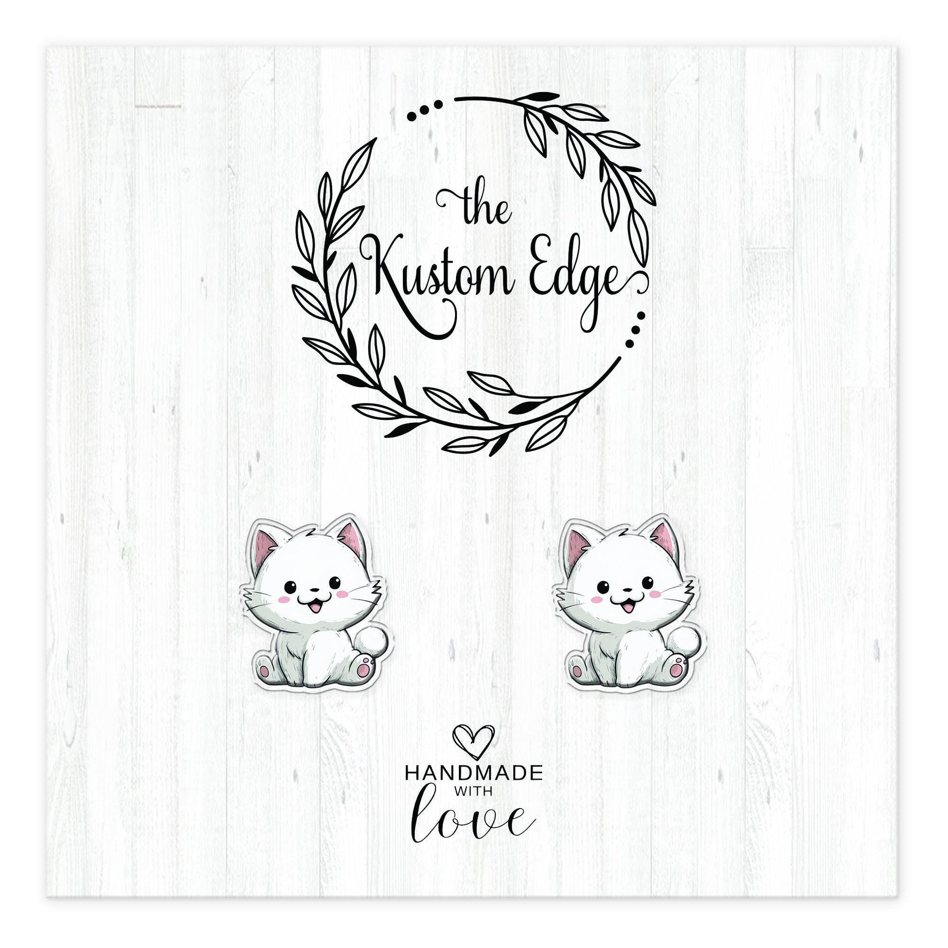 White kitten stud earrings on The Kustom Edge branded earring card