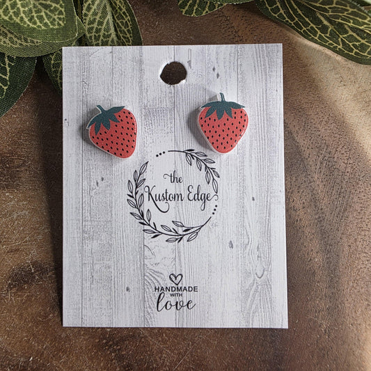 Strawberry stud earrings on branded card