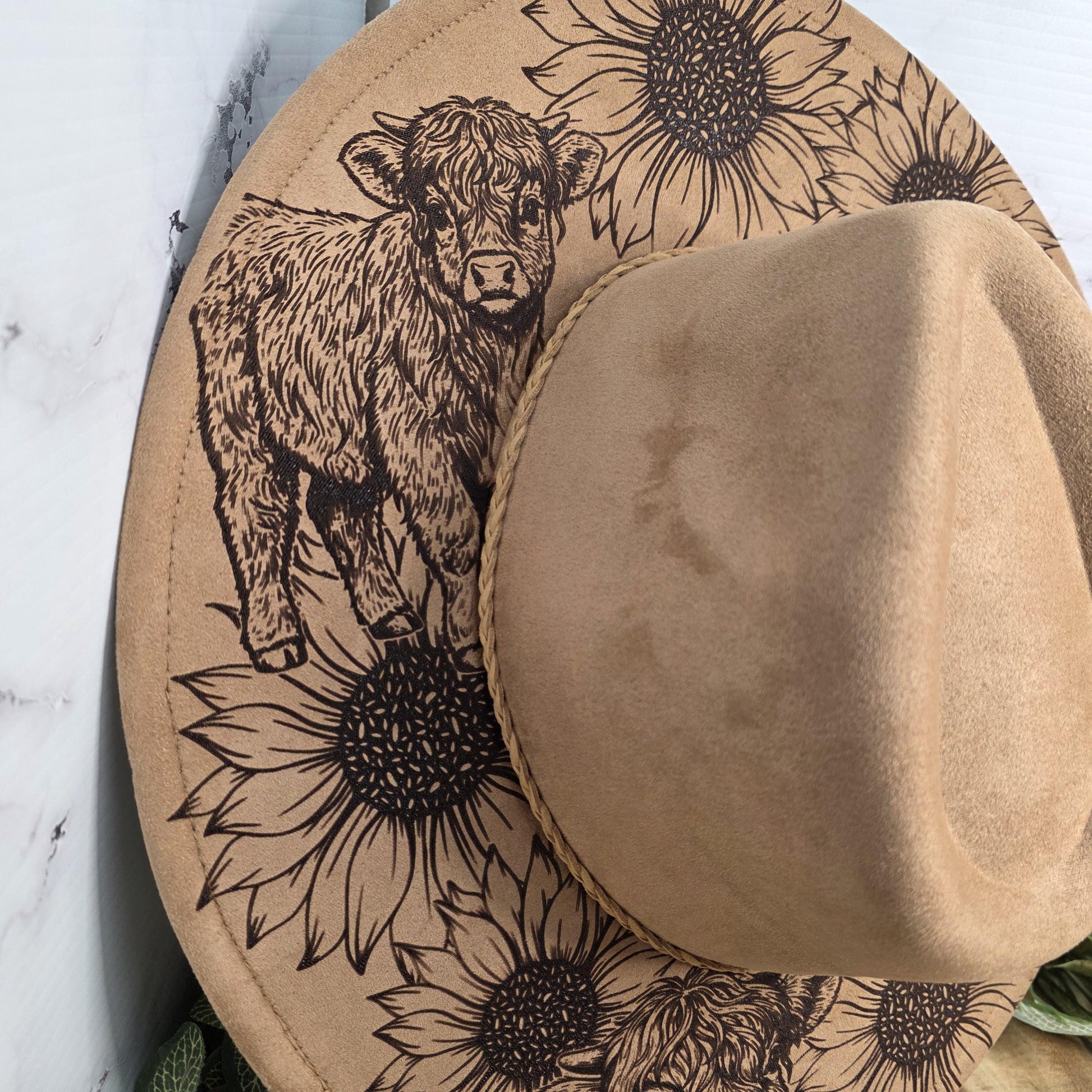 Laser engraved western hat with sunflowers and cows on vegan suede