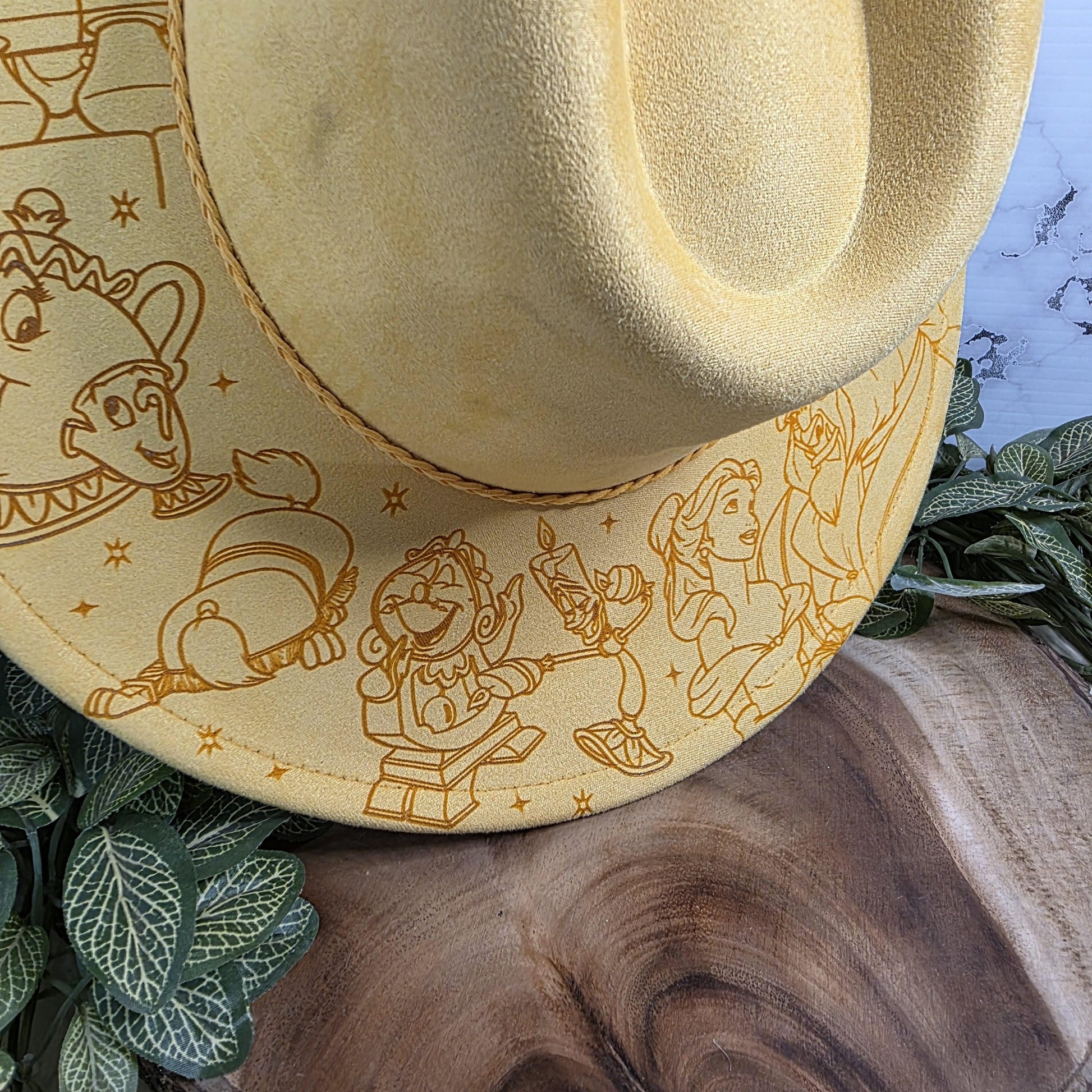 Beauty and the Beast inspired engraved fedora hat flat lay