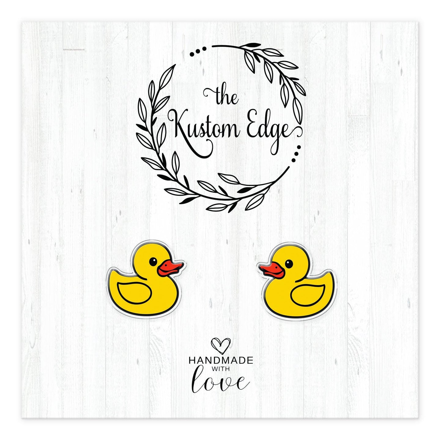 Rubber duck stud earrings on The Kustom Edge branded earring card