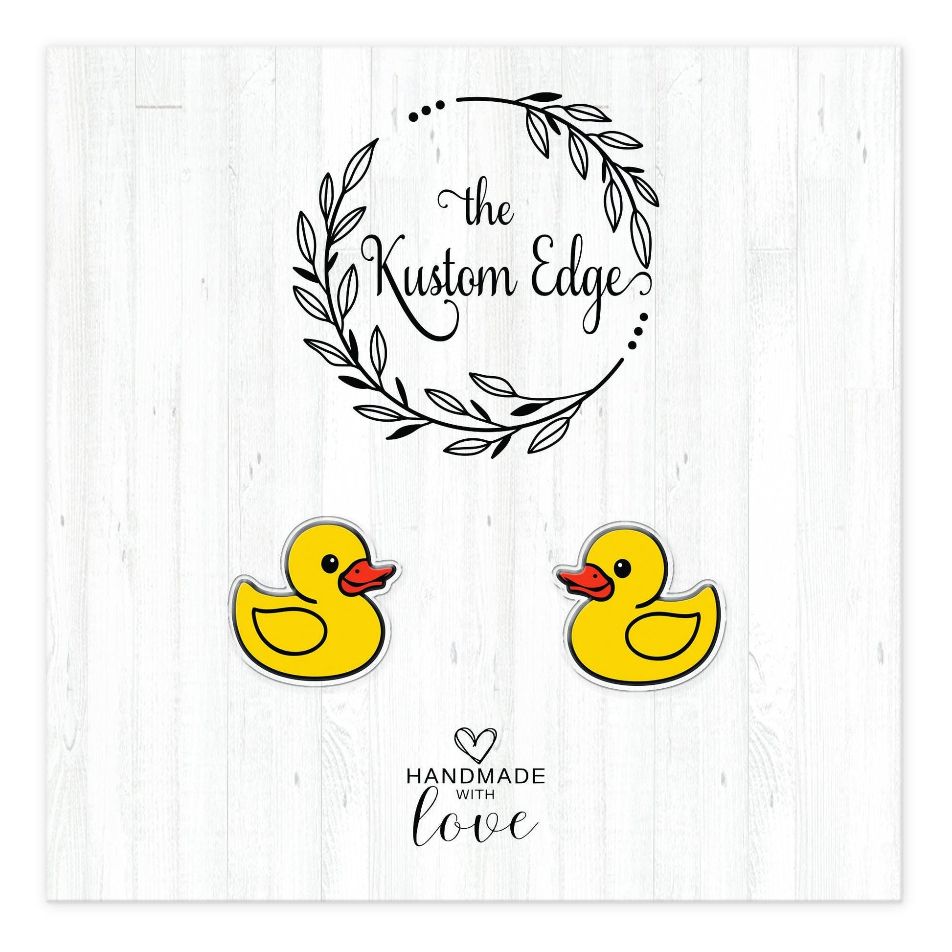 Rubber duck stud earrings on The Kustom Edge branded earring card