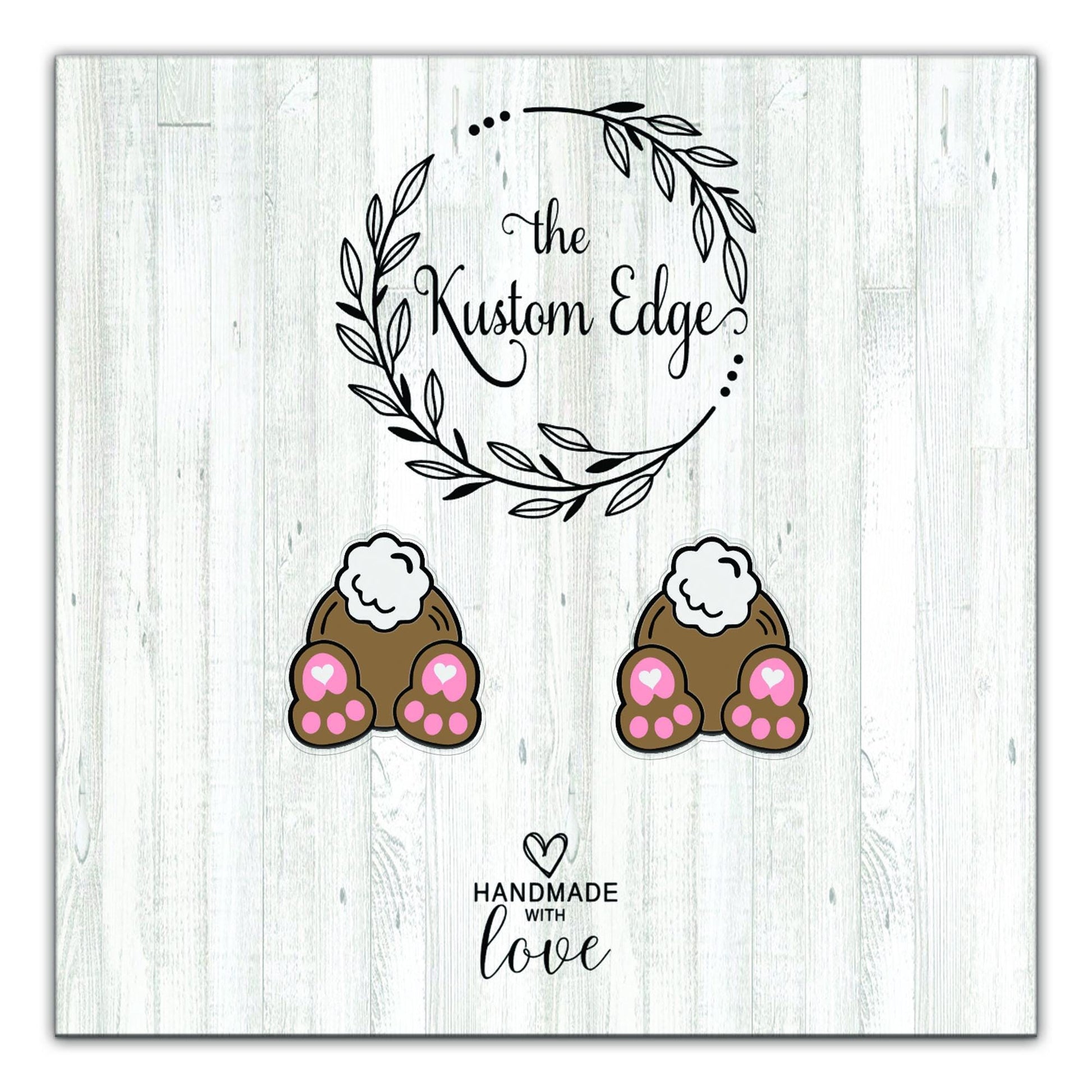 Bunny paw stud earrings with pink hearts on The Kustom Edge earring card