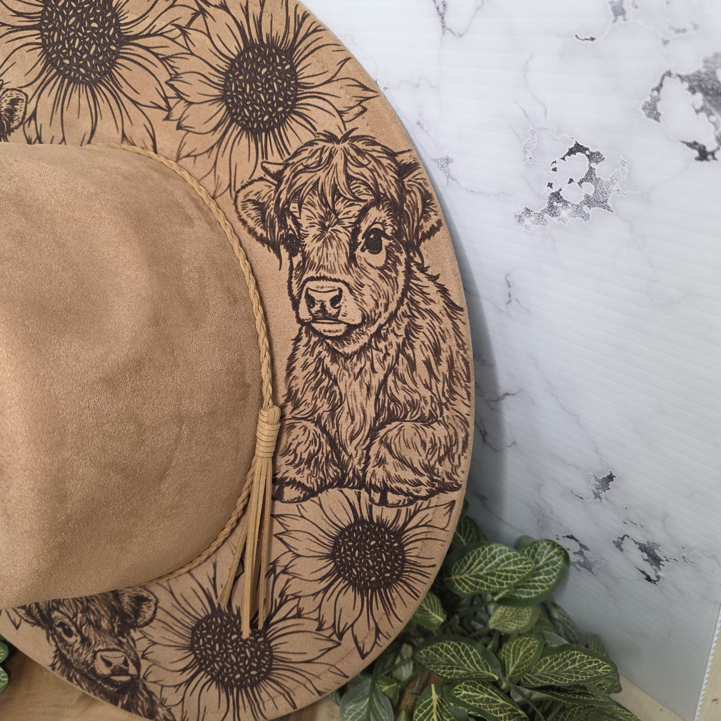 Laser engraved vegan suede hat with sunflowers and highland cows design