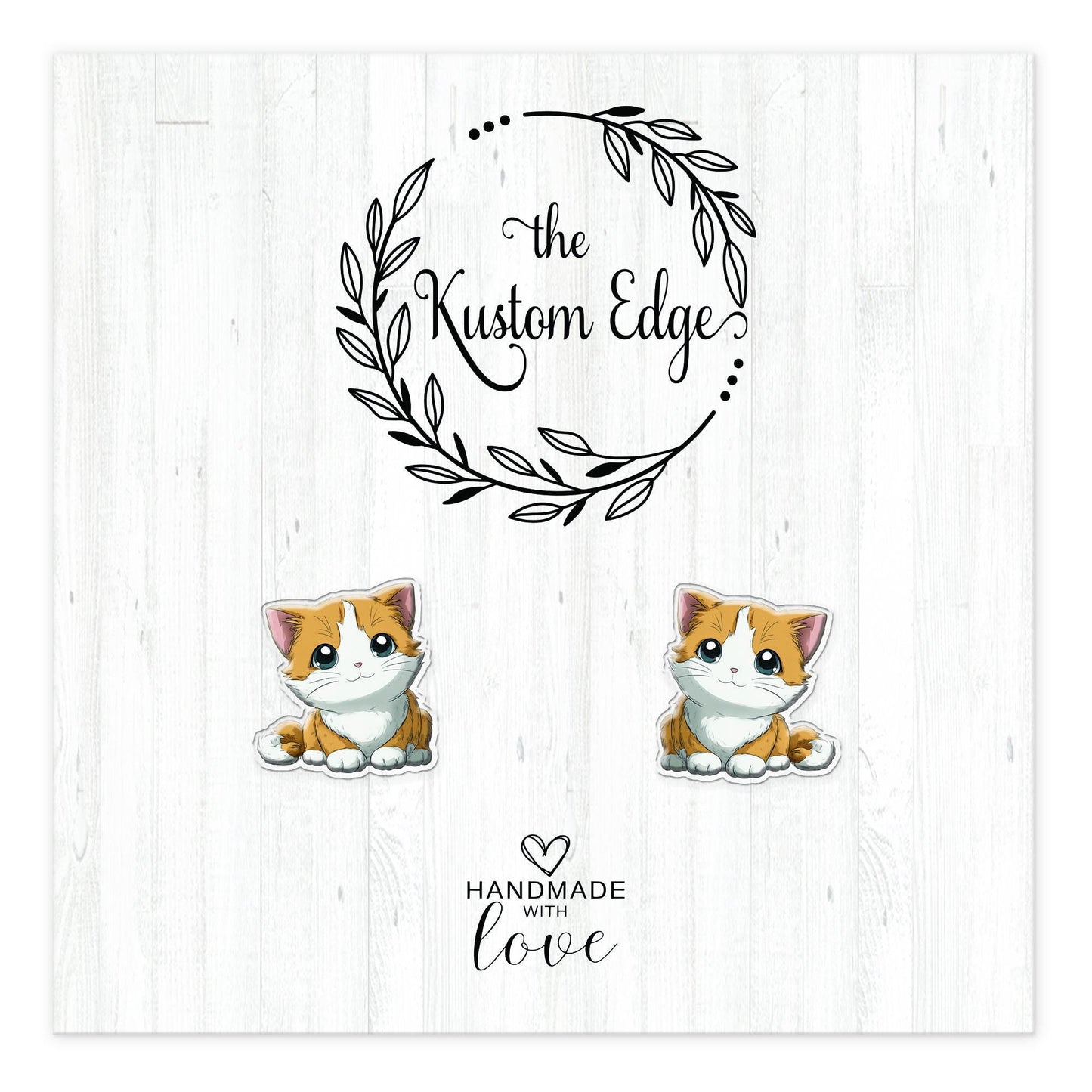Orange and white kitten stud earrings on The Kustom Edge branded earring card