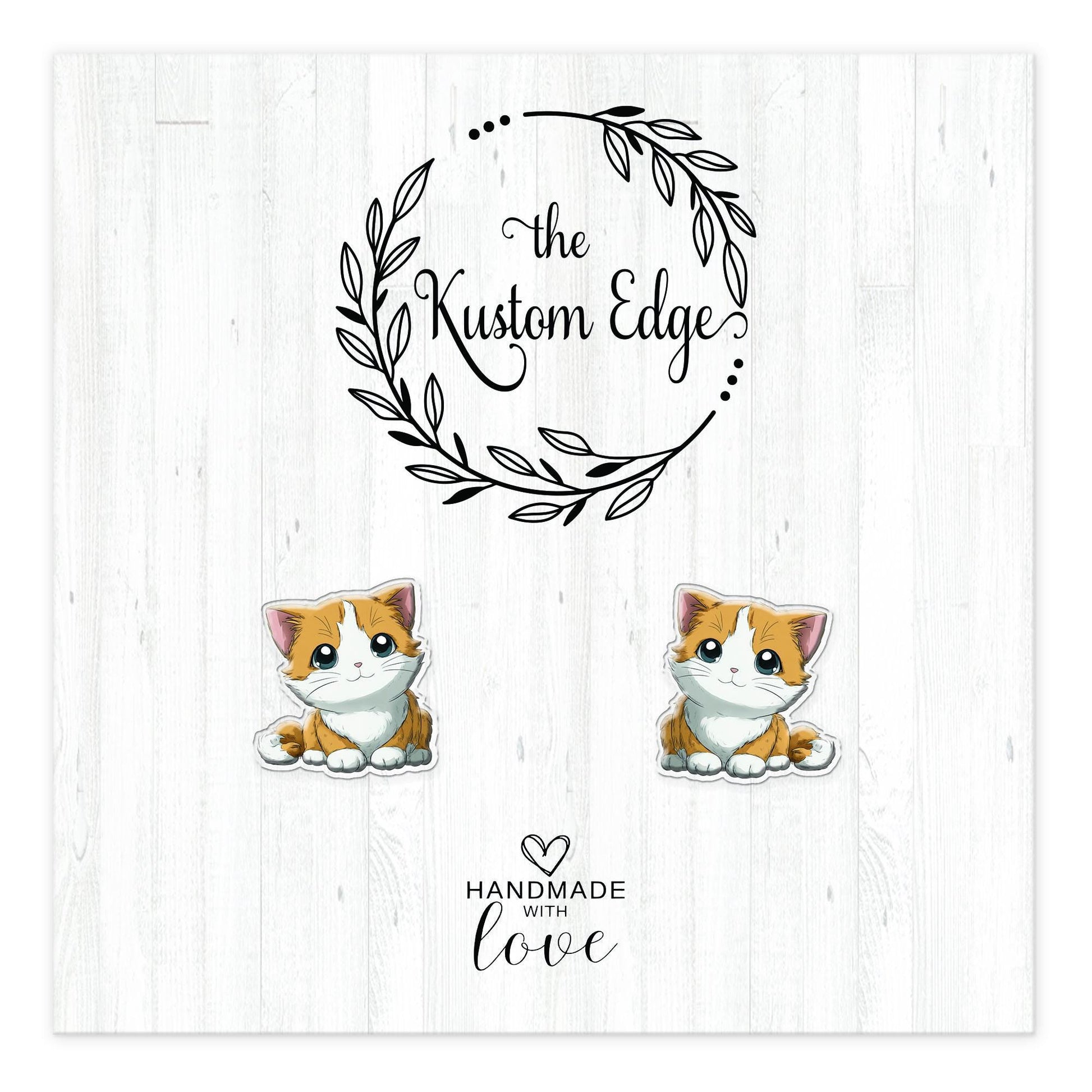 Orange and white kitten stud earrings on The Kustom Edge branded earring card
